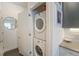 Stacked washer and dryer in a closet, conveniently located off the main hallway at 2550 Lawrence St # 106, Denver, CO 80205