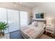 Bedroom featuring a large window, neutral color scheme, and a comfortable bed, creating a relaxing and serene atmosphere at 2550 Lawrence St # 106, Denver, CO 80205