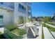 Outdoor picnic area with communal tables and well-maintained landscaping at 2550 Lawrence St # 106, Denver, CO 80205