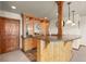 Basement bar area features granite countertops, custom cabinetry, and decorative lighting for entertaining at 6169 Flat Creek Dr, Evergreen, CO 80439