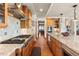 A gourmet kitchen features high-end appliances, granite countertops, and custom cabinetry for a chef-inspired space at 6169 Flat Creek Dr, Evergreen, CO 80439