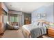 Comfortable main bedroom with natural light and neutral tones at 6169 Flat Creek Dr, Evergreen, CO 80439