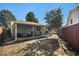 Backyard with covered patio and wood fence at 1641 Biscay Cir, Aurora, CO 80011
