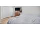 Bedroom features a TV on a dresser with wood flooring and large closet at 1641 Biscay Cir, Aurora, CO 80011
