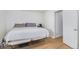 Bedroom with a bed and view of closet with wood flooring at 1641 Biscay Cir, Aurora, CO 80011