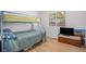 Bedroom with bunk beds, view of window, and laminate wood flooring at 1641 Biscay Cir, Aurora, CO 80011