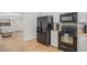Open-concept kitchen with modern appliances, stylish backsplash, and adjacent dining area, perfect for entertaining at 1641 Biscay Cir, Aurora, CO 80011