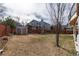 Wide open backyard with shed and a wooden fence, offering space for outdoor activities at 1738 Jules Ct, Highlands Ranch, CO 80126