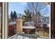Charming balcony with wrought iron railing, outdoor seating, and views of the surrounding neighborhood at 2411 S Milwaukee St, Denver, CO 80210