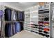Organized walk-in closet with shelving and hanging rods for ample storage at 2411 S Milwaukee St, Denver, CO 80210