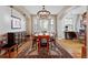 Inviting dining room featuring hardwood floors, large windows, and seating for Gathering and friends at 2411 S Milwaukee St, Denver, CO 80210