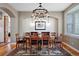 Elegant dining room featuring a stylish chandelier and ample seating for gatherings at 2411 S Milwaukee St, Denver, CO 80210