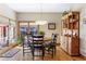 Cozy dining room featuring hardwood floors, ample natural light, and classic wooden furniture at 2411 S Milwaukee St, Denver, CO 80210