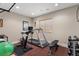 Exercise room with treadmill, exercise bike, weight bench, free weights and rubber flooring at 2411 S Milwaukee St, Denver, CO 80210