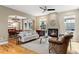 Inviting living room with hardwood floors, fireplace, and open access to the dining room at 2411 S Milwaukee St, Denver, CO 80210