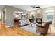 Beautiful living room with hardwood floors, a fireplace, comfortable seating, and dining room view at 2411 S Milwaukee St, Denver, CO 80210
