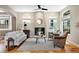Cozy living room featuring a fireplace, hardwood floors, comfortable seating, and bright windows at 2411 S Milwaukee St, Denver, CO 80210