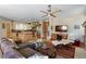 Open-concept living room with hardwood floors seamlessly connects to the kitchen and dining area at 2411 S Milwaukee St, Denver, CO 80210
