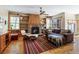Cozy living room with built-in shelving, fireplace, and ample natural light at 2411 S Milwaukee St, Denver, CO 80210
