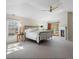 Bright main bedroom featuring a fireplace, vaulted ceilings, carpet flooring and a private deck at 2411 S Milwaukee St, Denver, CO 80210