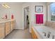 Bright bathroom featuring a tub at 512 Cardens Pl, Erie, CO 80516