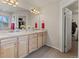 Bathroom featuring double sinks and a walk in closet at 512 Cardens Pl, Erie, CO 80516