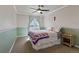 A cozy bedroom featuring a ceiling fan and window at 512 Cardens Pl, Erie, CO 80516