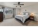 Comfortable bedroom with large window and neutral decor at 512 Cardens Pl, Erie, CO 80516