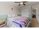 Cozy bedroom featuring a ceiling fan and closet at 512 Cardens Pl, Erie, CO 80516