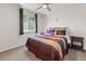 Comfortable bedroom with two side tables and a ceiling fan at 512 Cardens Pl, Erie, CO 80516