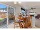 Dining area with backyard views, wood table, and easy access to living space at 512 Cardens Pl, Erie, CO 80516