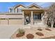 Charming home featuring stone and rock landscaping and a covered porch at 512 Cardens Pl, Erie, CO 80516