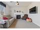 Inviting living room with a fireplace, TV, and comfortable seating at 512 Cardens Pl, Erie, CO 80516