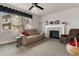 Relaxing living room with a fireplace, plush seating, and ambient lighting at 512 Cardens Pl, Erie, CO 80516