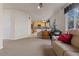 Spacious living room with kitchen view and comfortable seating area at 512 Cardens Pl, Erie, CO 80516