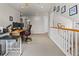 Upstairs office area with desk, dual monitors, and lots of natural light at 512 Cardens Pl, Erie, CO 80516