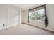 Bedroom with carpet, double door closet and window at 12338 W Dorado Pl # 206, Littleton, CO 80127