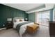 Spacious bedroom with plush bedding and access to a balcony at 12338 W Dorado Pl # 206, Littleton, CO 80127