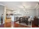 Open dining area with a table set for six, a view into the kitchen, and wood floors at 12338 W Dorado Pl # 206, Littleton, CO 80127