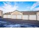 Row of well-maintained garages providing ample parking and storage for residents with paved driveway at 12338 W Dorado Pl # 206, Littleton, CO 80127