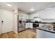 Efficient kitchen featuring stainless steel appliances, ample cabinet space, and durable floors at 12338 W Dorado Pl # 206, Littleton, CO 80127