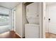 Efficient laundry area with a stacked washer and dryer tucked in a closet at 12338 W Dorado Pl # 206, Littleton, CO 80127