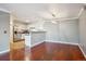Spacious living room with hardwood floors, and view to dining area and kitchen at 12338 W Dorado Pl # 206, Littleton, CO 80127