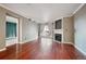 Living room with hardwood floors, fireplace, and access to balcony at 12338 W Dorado Pl # 206, Littleton, CO 80127