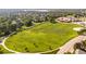 Expansive green fields are situated near a school, with sidewalks, and residential houses at 19428 E Crestridge Cir, Centennial, CO 80015