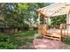 A wooden pergola covers the stairs to the home's deck, with plenty of backyard space at 19428 E Crestridge Cir, Centennial, CO 80015