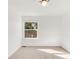 A naturally lit, carpeted bedroom offers a bright, inviting space with simple, clean design at 19428 E Crestridge Cir, Centennial, CO 80015