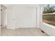 Bedroom with white sliding closet doors, neutral carpet, and a large picture window at 19428 E Crestridge Cir, Centennial, CO 80015