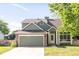 Charming two-story home with attached two car garage and stone detailing at 19428 E Crestridge Cir, Centennial, CO 80015