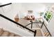 Open foyer features a view of the living room with modern furniture, a large window, and natural light at 19428 E Crestridge Cir, Centennial, CO 80015